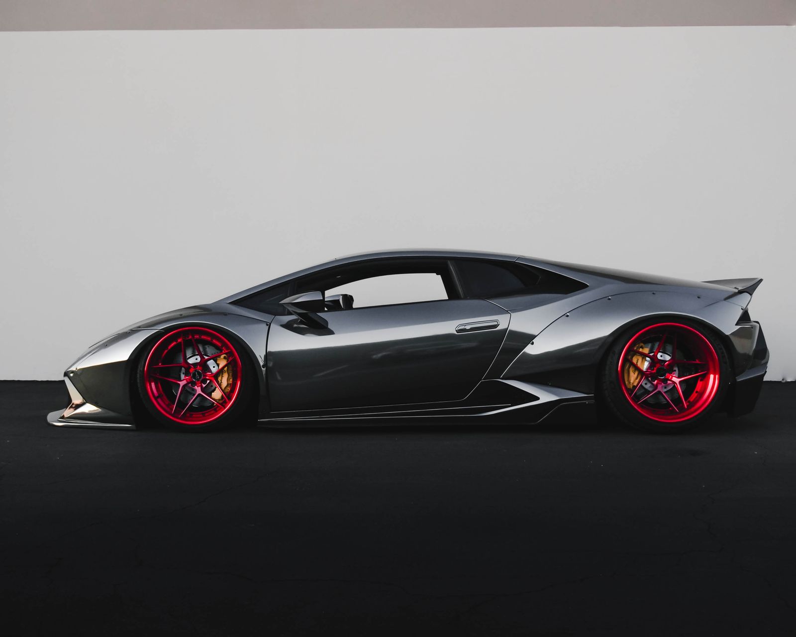 Low-profile performance car in a studio setting for the about page