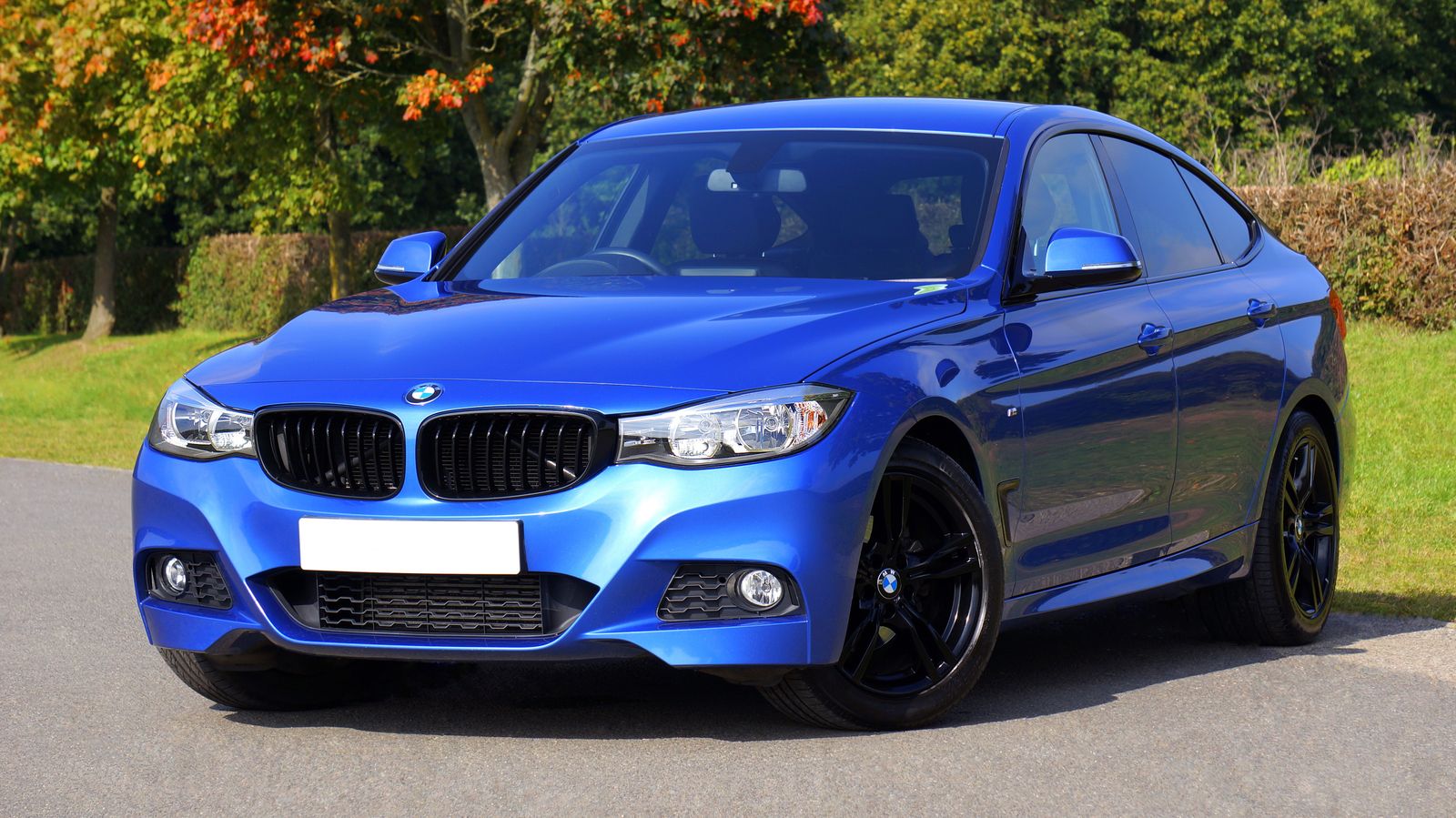 Blue sedan parked outdoors for the home page hero image